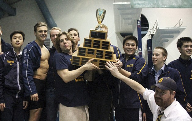 The Bellevue Wolverines boys swim team celebrates after capturing the Class 3A state swim and dive championship for the second consecutive season.