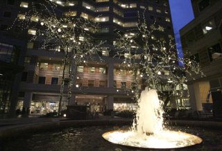 The courtyard of Bellevue Place is lit with holiday lights on Tuesday