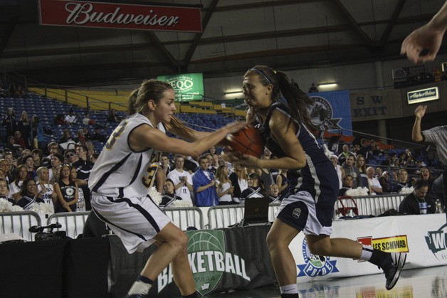 Bellevue's Shelby Cansler fights for a loose ball during her team's win over Glacier Peak.