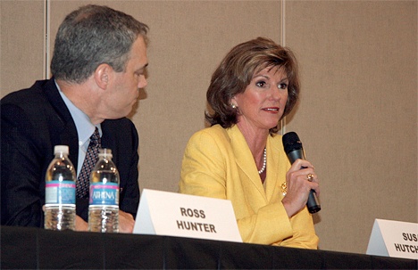 Ross Hunter listens as Susan Hutchison answers a question during a forum for candidates for King County Executive Thursday evening in North Bend.