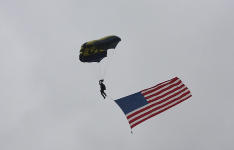 A U.S. Navy Leap Frog parachutes into Surrey Downs park during the Navy SEAL Fitness Challenge Aug. 8 in Bellevue.