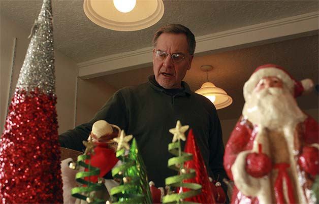 Keith Galpin packs up remaining inventory at the Christmas House in Bellevue on Tuesday