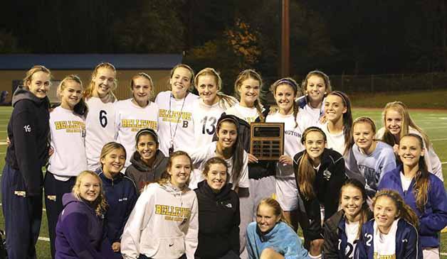 The Bellevue girls soccer team with the KingCo title plaque.