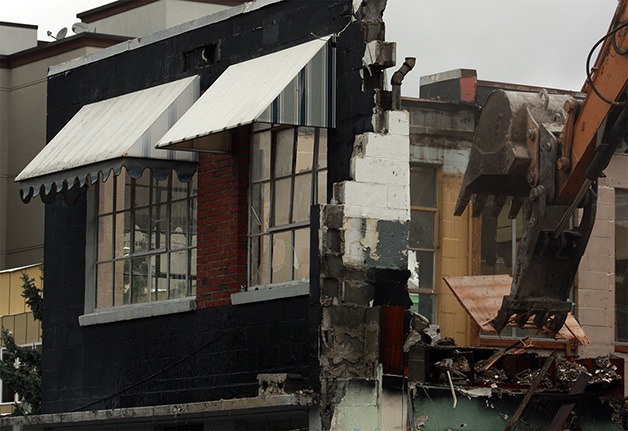 The former site of Bellevue's Fire District No. 14 station was torn down Monday for new construction at 102nd Avenue Southeast and Northeast First Place. The fire station served the unincorporated