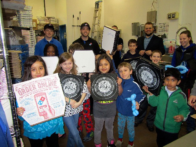 Boys & Girls Clubs of Bellevue kids got a special tour of a new Domino's pizza store in downtown Bellevue on Wednesday