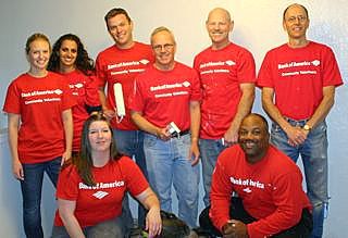 Bank of America Community Volunteers help paint apartment unit for homeless family at Housing at the Crossroads in Bellevue.