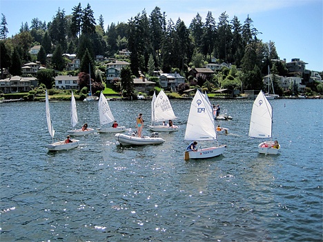 Students practice their sailing skills as an instructor watches their progress on Meydenbauer Bay.