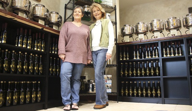 From left: Bonnie Campbell and Dee Dee Fike opened Two Sisters Olive Oil just after Thanksgiving after losing their jobs last year. They chose Bellevue because of its affluent population