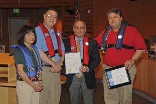 Bellevue Mayor Grant Degginger with three members of the Bellevue Sail and Power Squadron. Pictured left to right are Barbara Erickson