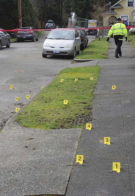 This photo taken during an investigation into the March 2012 shooting death of Russell Wilson by Bellevue SWAT members shows evidence cards placed where numerous bullet casings were found.