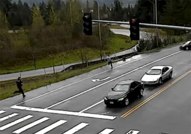 Police chase one of the suspected mail thieves