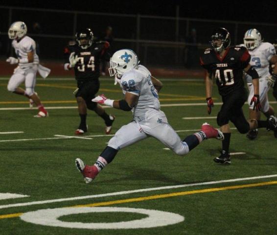 Interlake running back Jordan Todd carries the ball during the Saints' Crossroads Cup win on Friday at Sammamish High School. The senior scored five touchdowns