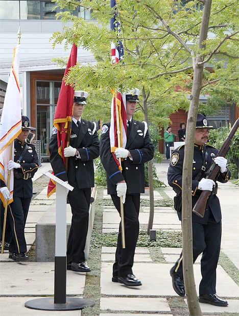 Members of the Bellevue Police and Fire departments form an honor guard as part of the city's 9/11 remembrance Saturday at City Hall.