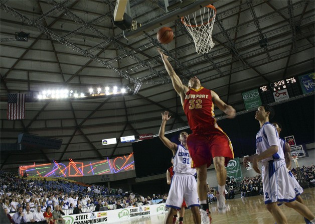 Newport's Isaac Dotson attempts a shot as three Curtis defenders look on.