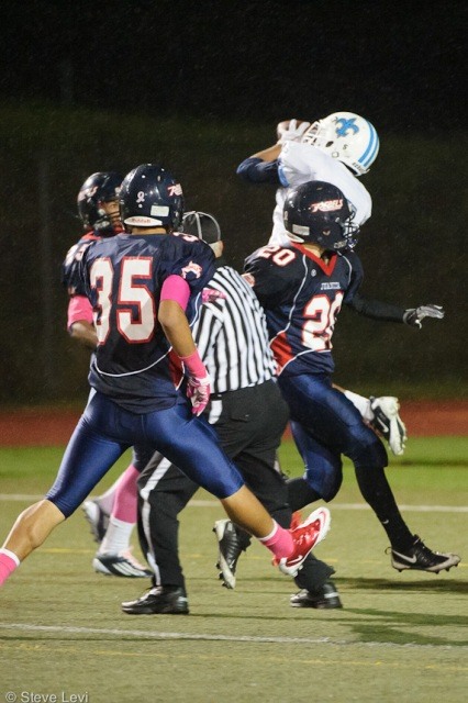 Three Rebels' defenders look on as Evan Turman catches a game-tying touchdown with only 38 seconds remaining in regulation.