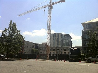 A crane appeared on Northeast 12th Street in Bellevue as construction began on the Park Metro apartment complex July 31.