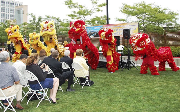 Lion dancers weave through the crowd.