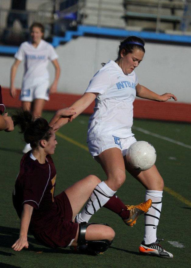 Interlake's Emma Bergstrom fights for a ball during the Saints' 2-0 district playoff win over White River.