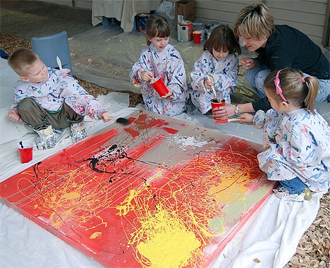 Preschool students at Eastside Christian School work on one of their paintings