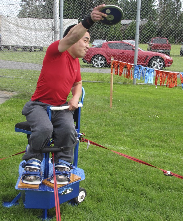 Ferreira tossing a discus in the chair Perry calls the