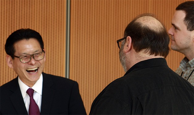 Brad Miyake chats with city staff members during a meet-and-greet with city manager finalists on Friday