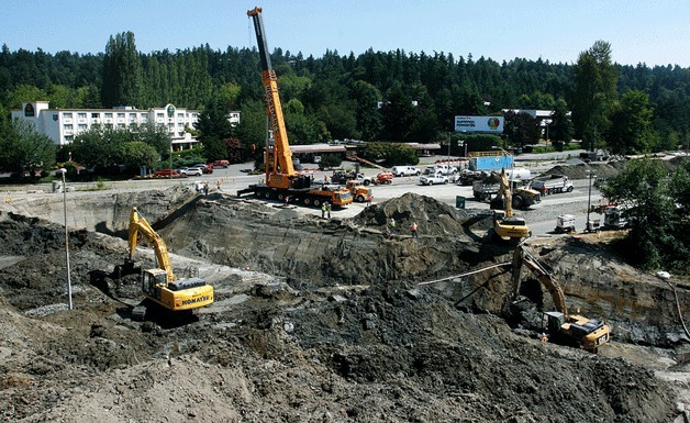 Construction crews closed SR 520 in Bellevue to install a massive fish-friendly culvert underneath all lanes of the highway. The trench is 25 feet deep and 80 feet across. The culvert