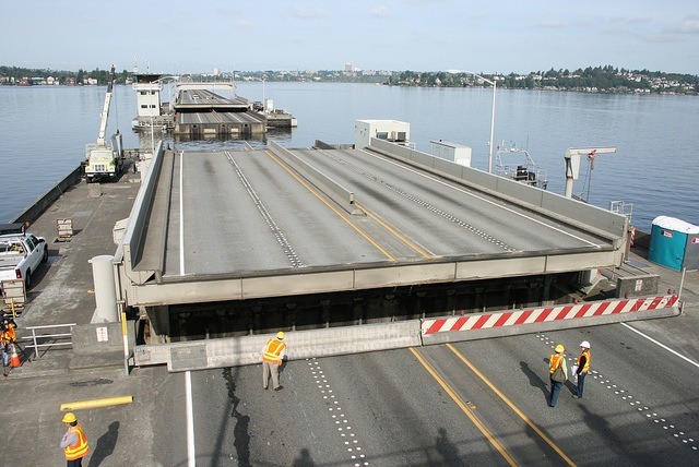 The drawspan of the SR 520 bridge opens during the annual maintenance and inspection closure Saturday