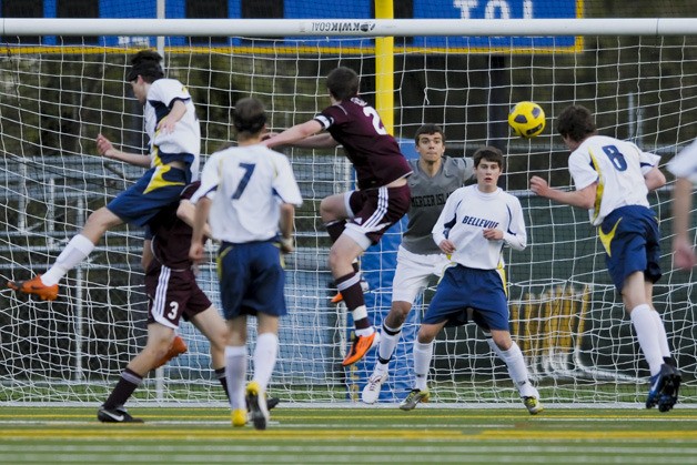 Garrett Jackson (8) attempts a header against Mercer Island. Jackson scored his first two goals of the season against the Islanders.