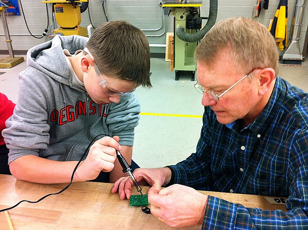 A middle school student works with Dr. Pinky Nelson