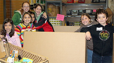 Students from the Bellevue-based Jewish Day School of Metropolitan Seattle worked to sort groceries for the Hopelink food pantry in Kirkland.