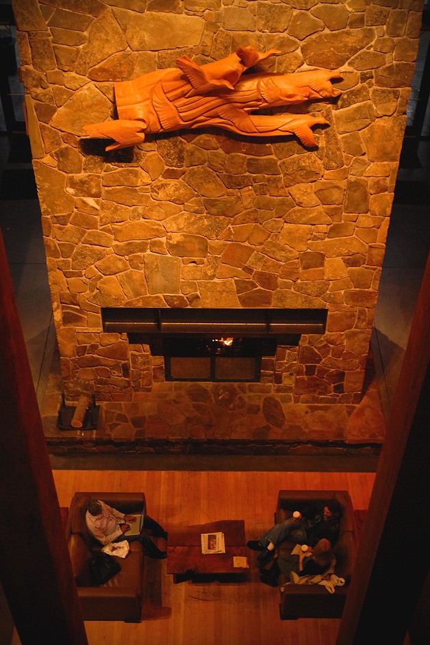 Visitors enjoy the fireplace in The Lodge