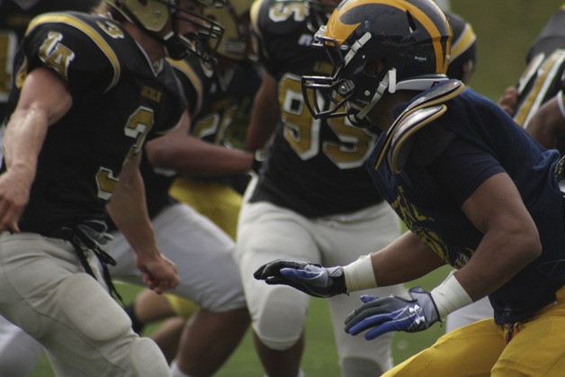 Bellevue's Tyler Hasty prepares to take on a block during a spring scrimmage with Lincoln before the 2011 season. Hasty