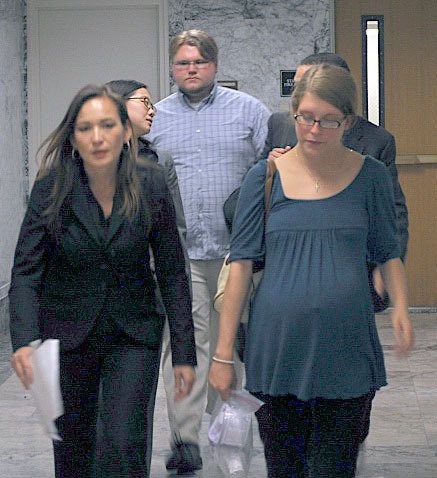 Brittainy Labberton (front right) walks out out of a King County Superior Court room with her attorney