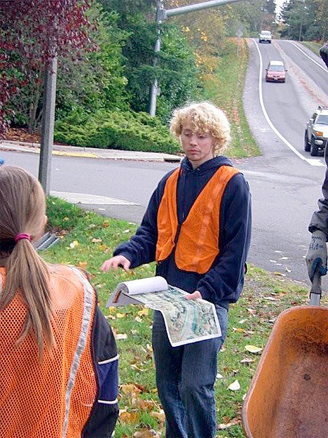 Dillon More reviews the planting map for his Eagle Scout project.