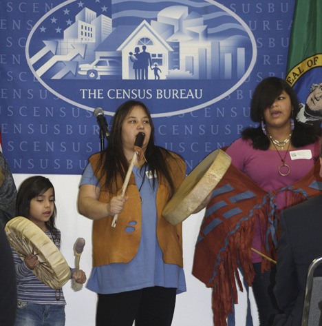 Members of the Snoqualmie Indian Tribe perform a song during an event to mark the opening of a new U.S. Census bureau in Bellevue.