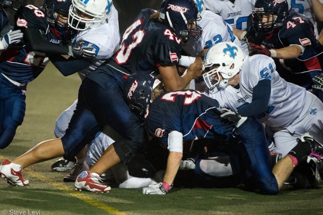 The Juanita defense meets Interlake running back Jordan Todd (22) near the goal line on the final play of the game.