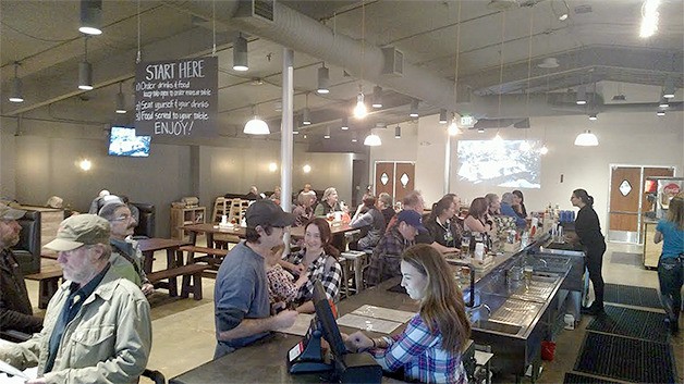 Customers order pizza and beer during the grand opening of Resonate Brewery and Pizzeria while 80s pop-chart hits play over the speakers and on the back wall. Food offerings include the PNP (pig ‘n’ pineapple) pizza and meatball appetizers. A cultivated beer selection will be rapidly changing to allow Resonate’s house beers to dazzle hopheads and newbies alike.