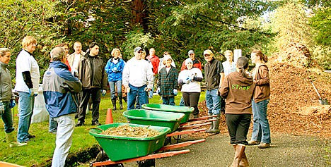 Realtors get their assignments as they begin a restoration of Seattle's Seward Park.