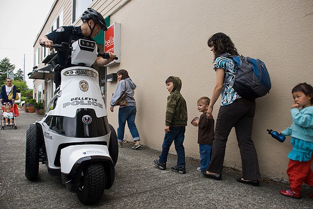 Bellevue Police officer My Tran rides the downtown unit's new T3 motorized vehicle through the Old Main neighborhood of Bellevue during a media demonstration on Tuesday