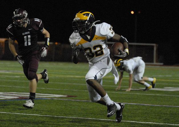 Budda Baker returns one of his two interceptions against Mercer Island earlier in the year. The sophomore has picked-off four passes and returned a pair of kicks for touchdowns for the top ranked Wolverines.