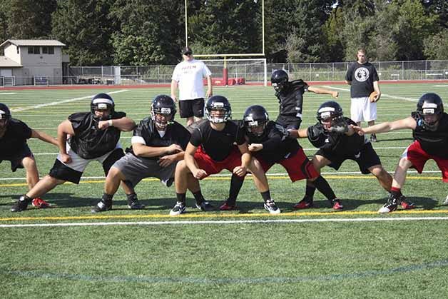 Sammamish and head coach Brian Tucci (back) hope 2013 can be a year of measurable success.