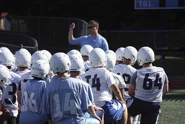 Interlake head coach Dave Myers talks to his team before the first day of fall camp.