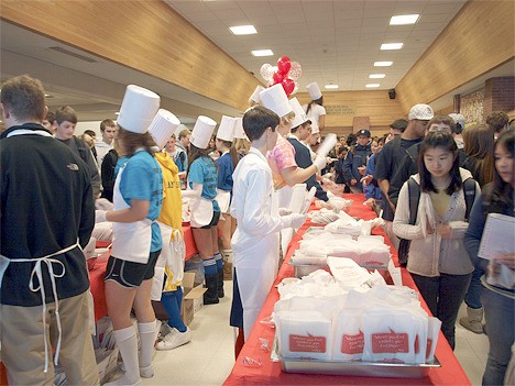 Students at Bellevue High School fill cups with soup and hand out cookies as part of the annual Soup4Simpson event that honors the memory of a former graduate