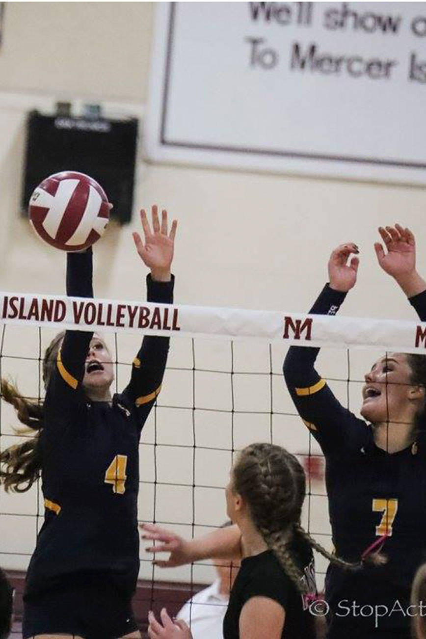 Photo courtesy of Don Borin/Stop Action Photography                                The Bellevue Wolverines captured second place at the KingCo 3A volleyball tournament on Oct. 28. The Wolverines defeated Redmond 3-0 in the first round but lost 3-1 to the Mercer Island Islanders in the championship match. Bellevue sophomore Jessica Buxton, left, and senior Callie Weber, right, leap into the air on a play against the Mercer Island Islanders. Bellevue will compete in the Class 3A Sea-King volleyball tournament from Nov. 1 through Nov. 4.