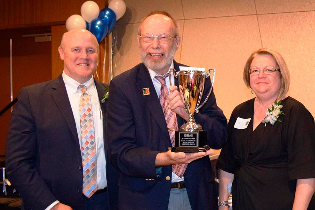 Johnson pictured with Overlake President and CEO Mike Marshand Chief HR and Chief Compliance Officer Lisa Brock. Photo courtesy of Overlake