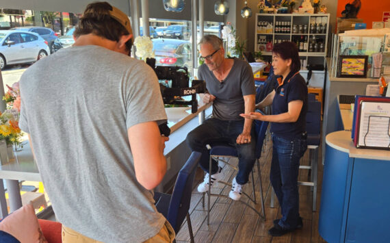 While filming the Issaquah Restaurant Spotlight series, Troy Kline tastes his favorite Thai dish at Sip Thai Zooom alongside restaurant owner Joon Likit.