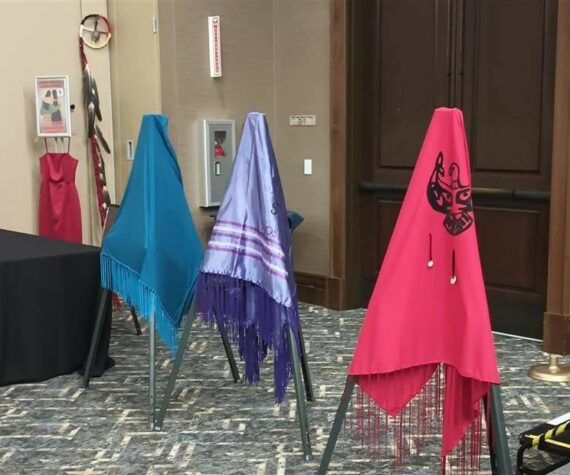 The Lummi Nation provided three colorful shawls during the MMIWP Task Force Summit in September, with turquoise representing human trafficking, purple representing overdoses (“losing our people from fentanyl”) and red representing murdered and missing Indigenous women — all crises that affect North American Natives and Tribes. The summit started with an opening ceremony with words from Lummi Tribal Chair Anthony Hillaire, Lummi Indian Business Council Secretary Lisa Wilson and a Shawl Ceremony with Lhaq’temish singers. Photo by Bailey Jo Josie/Sound Publishing